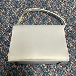 Gently used La Regale Ltd grey colored evening purse/clutch